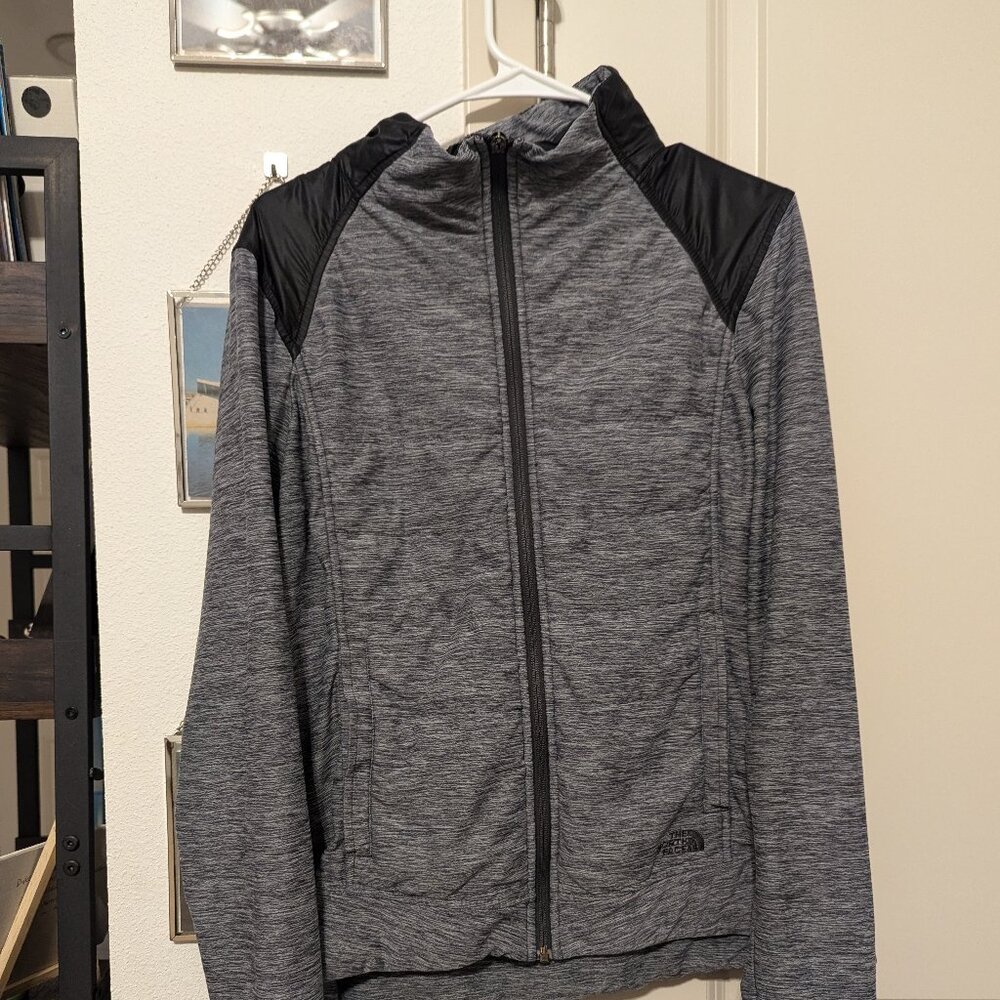 Grey and black insulated North Face jacket